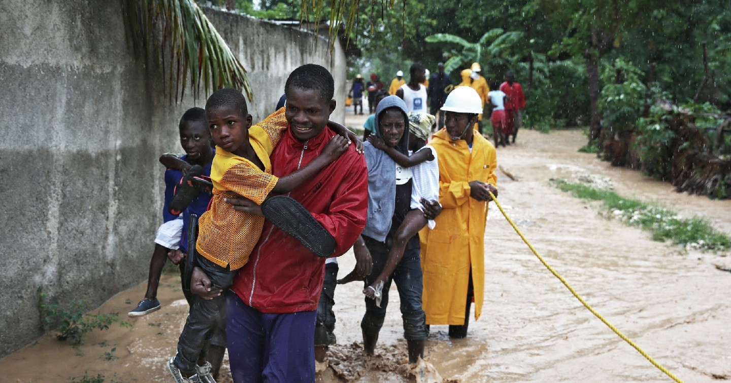 A photo of the rescue efforts following Hurricane Matthew is enclosed.  Credit: Christian Aid.