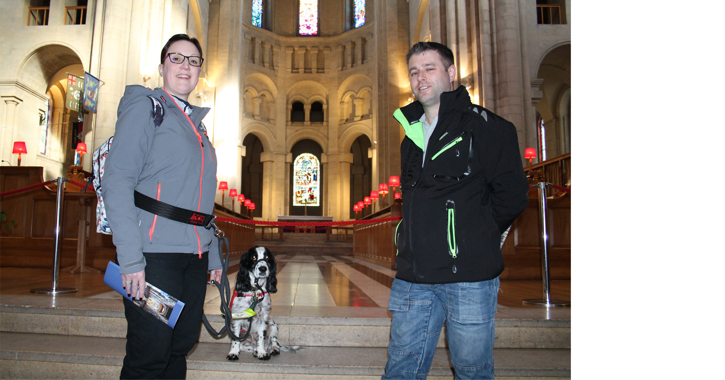 Michelle and Kris Sutherland in Belfast Cathedral with their pet Clive, a fully trained medical detection dog.