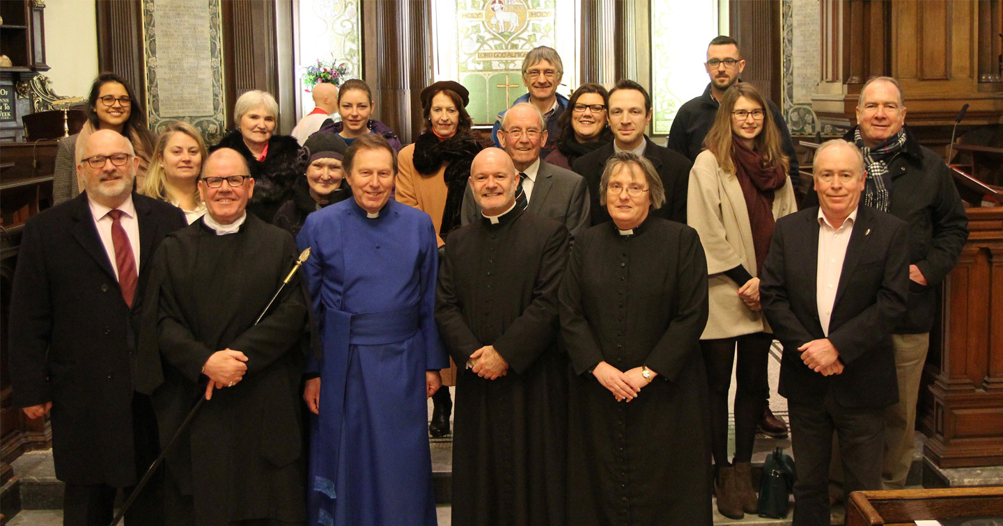 Representatives of the charities receiving funding from the 2016 Black Santa Sit Out at St Ann’s, Dawson Street, with the Dean of Belfast, the Very Revd John Mann, the Vicar of St Ann’s Canon David Gillespie, Assistant Priest the Revd Yvonne Ginnelly, and Verger Fred Deane.