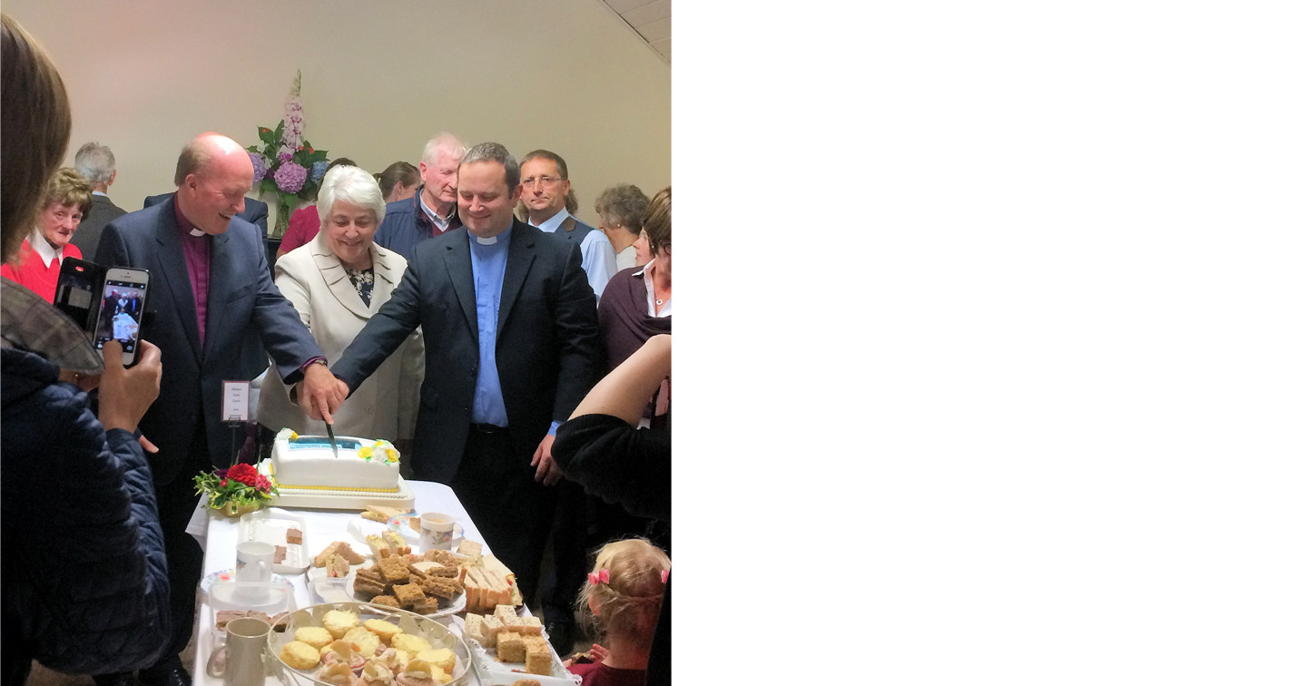 Bishop Ferran, Archdeacon Craig and Mrs Violet Kellett cutting the cake.