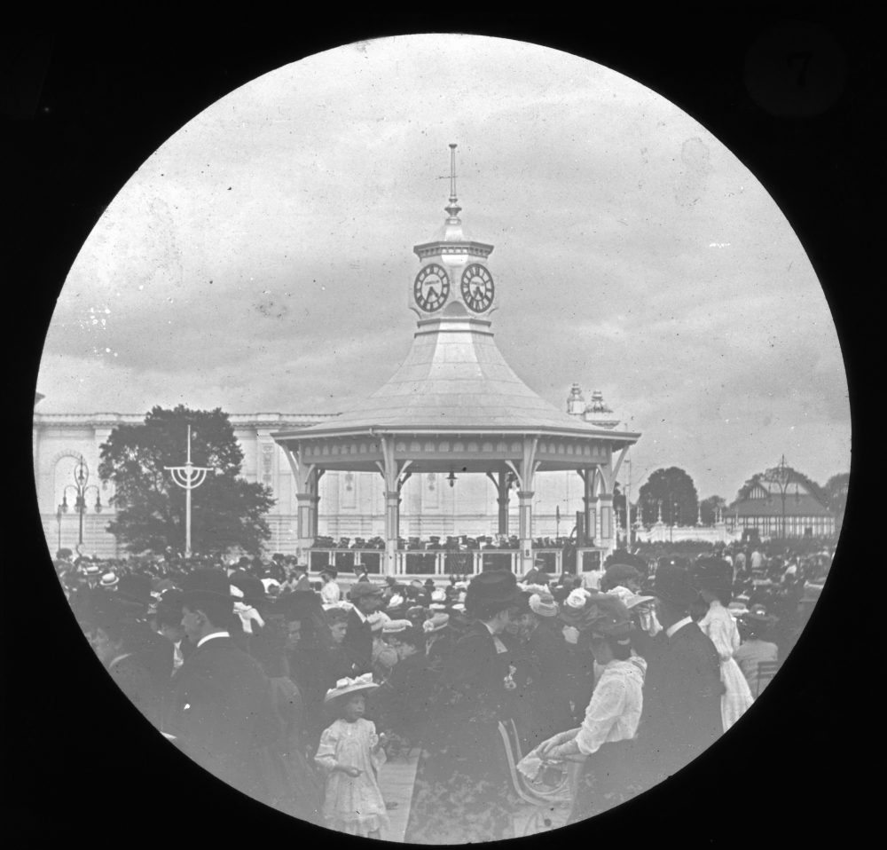 Bandstand with throngs of crowds at the International Irish Exhibition held in Dublin in 1907. Note the little girl in the front of the picture, RCB Library “Killaloe” LS/ Industrial Exhibition 4.