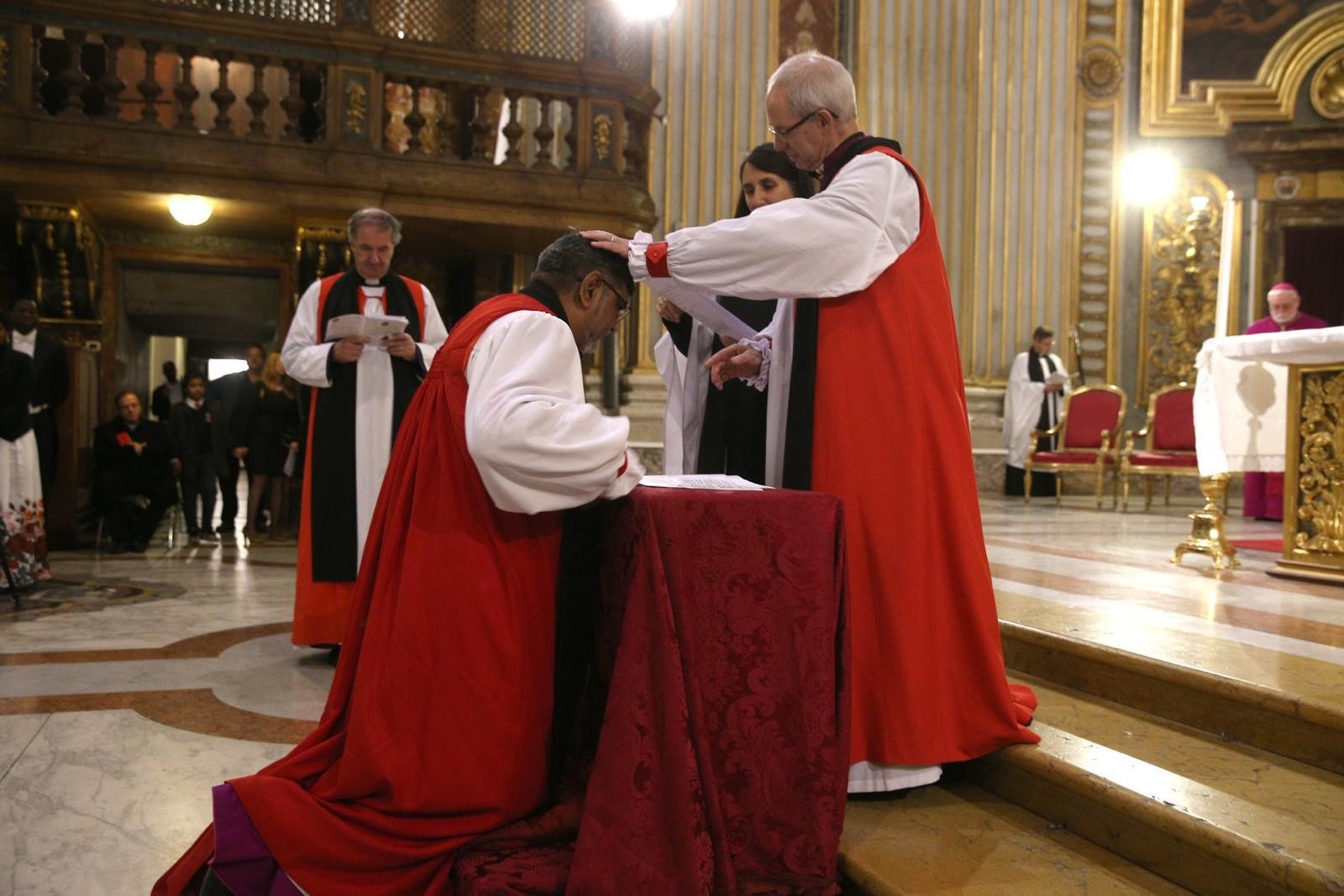 Archbishop Ian Ernest being commissioned as Director of the Centre by the Archbishop of Canterbury, the Most Revd Justin Welby, as Bishop Michael Burrows looks on in November 2019.