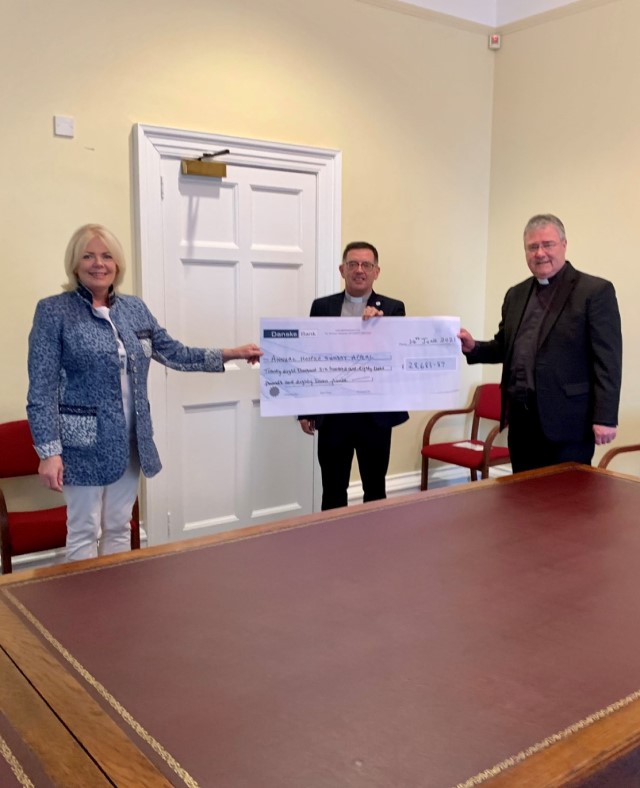 Mrs Jane Leighton, Diocesan Secretary for Armagh, the Revd Matthew Hagan and Archbishop John McDowell with a cheque representing the total recently raised.