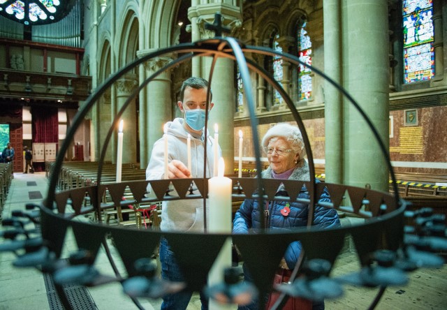 Scott Hornibrook and his grandmother Rosemary Beamish were the first to light candles during the day of private prayer at St Fin Barre's Cathedral, Cork, in memory of those who have died of Covid-19. Picture: Gerard McCarthy Photography.