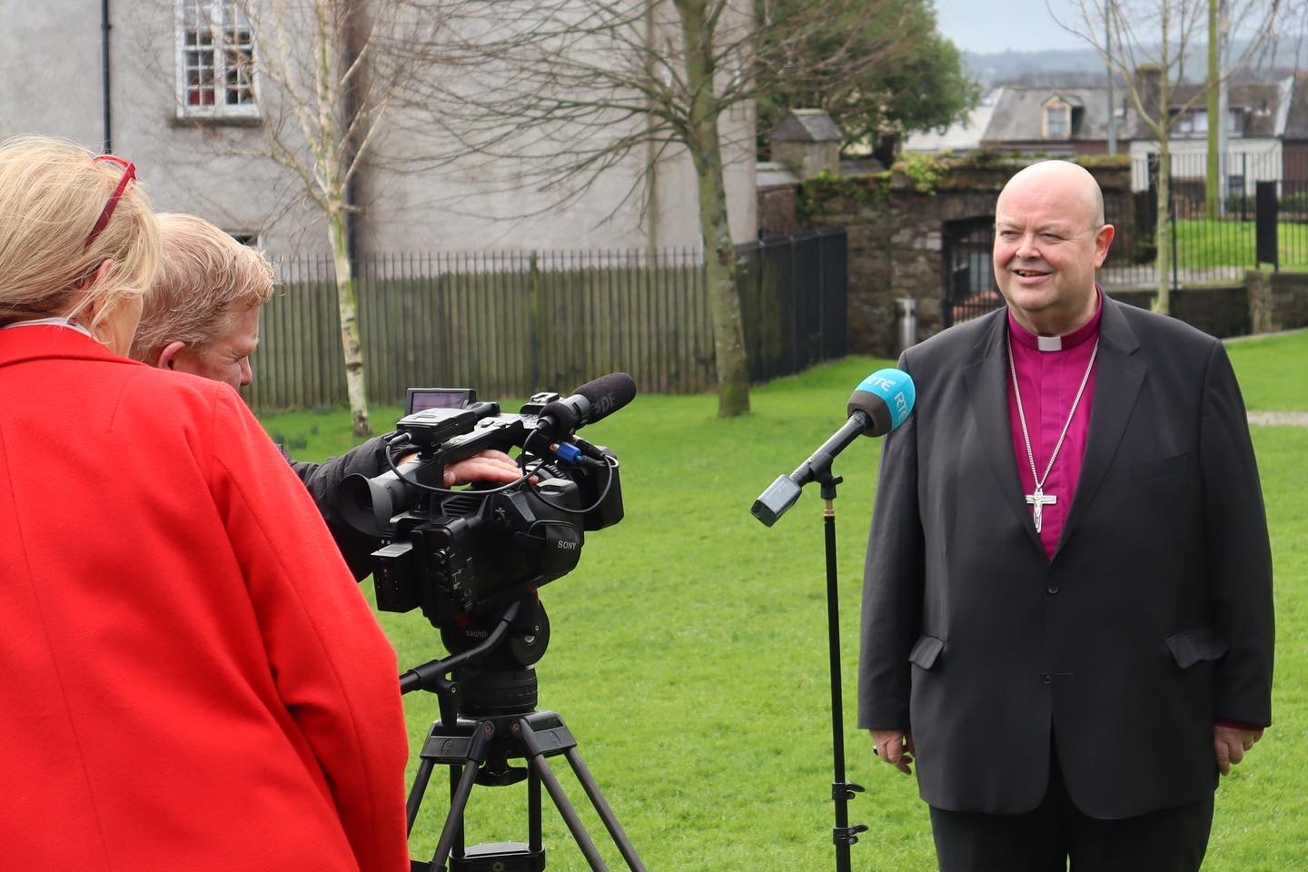 Bishop Paul giving an interview to RTÉ in the ground of Saint Anne's Church, Shandon.