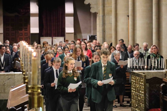 Students from the Secondary Schools processing into the Choir Stalls for the Service.