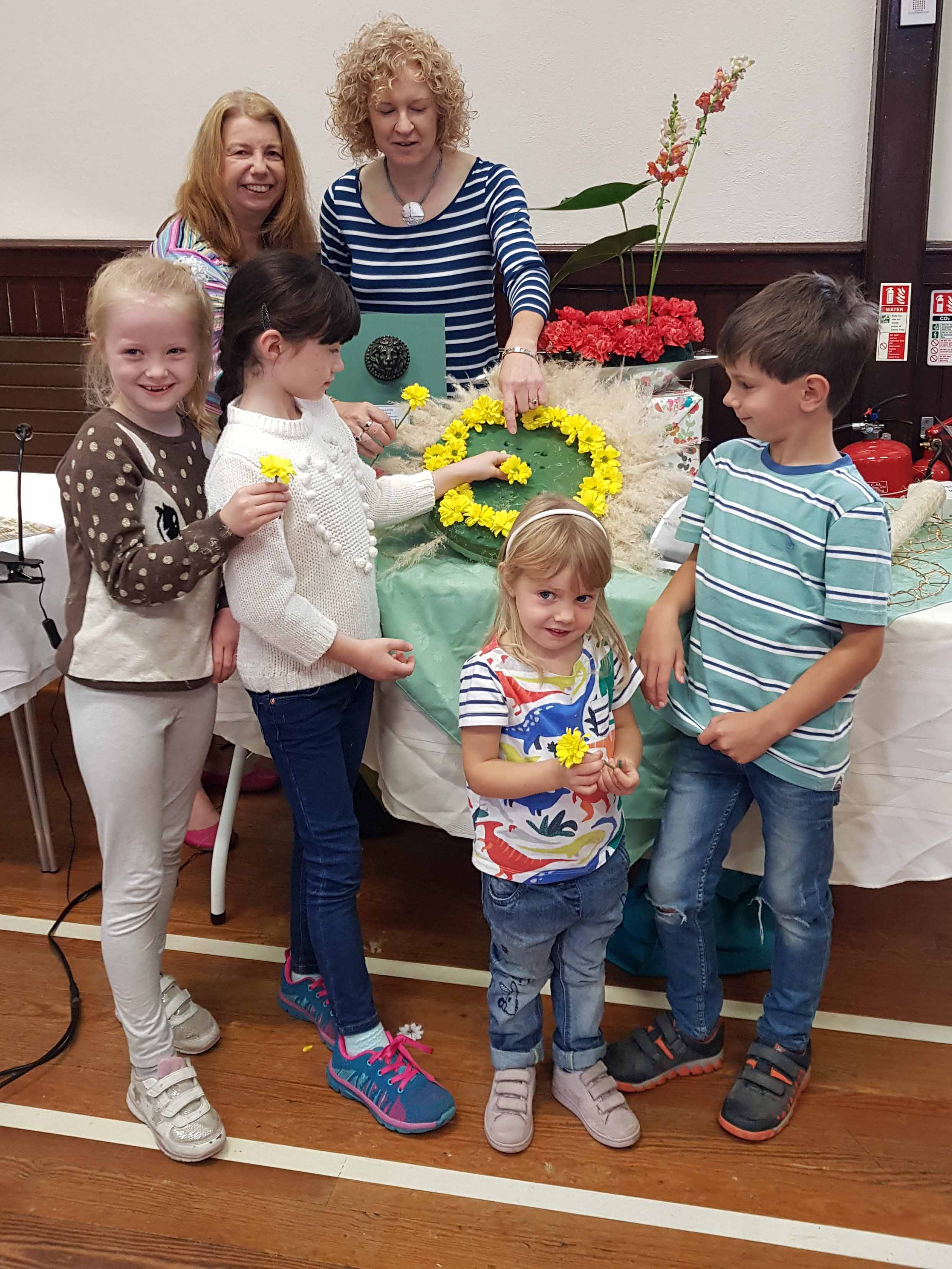 Valentina, Carla, Catherine and Arthur assist flower arrangers Johann Henderson and Hannah Nelson with their floral recreation of Aslan from ‘The Lion, the Witch and the Wardrobe'.