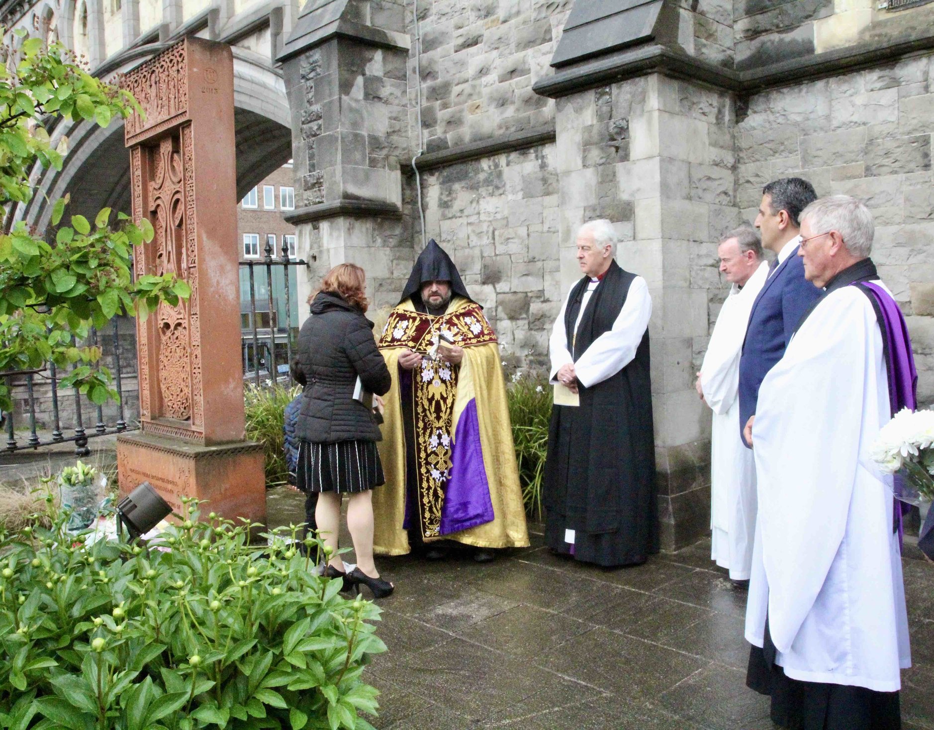 Bishop Hovakim Manukyan, Archbishop Michael Jackson, Honorary Armenian Consul, Ohan Yergainharsian and other participating clergy at the Khachkar memorial in the grounds of Christ Church Cathedral.