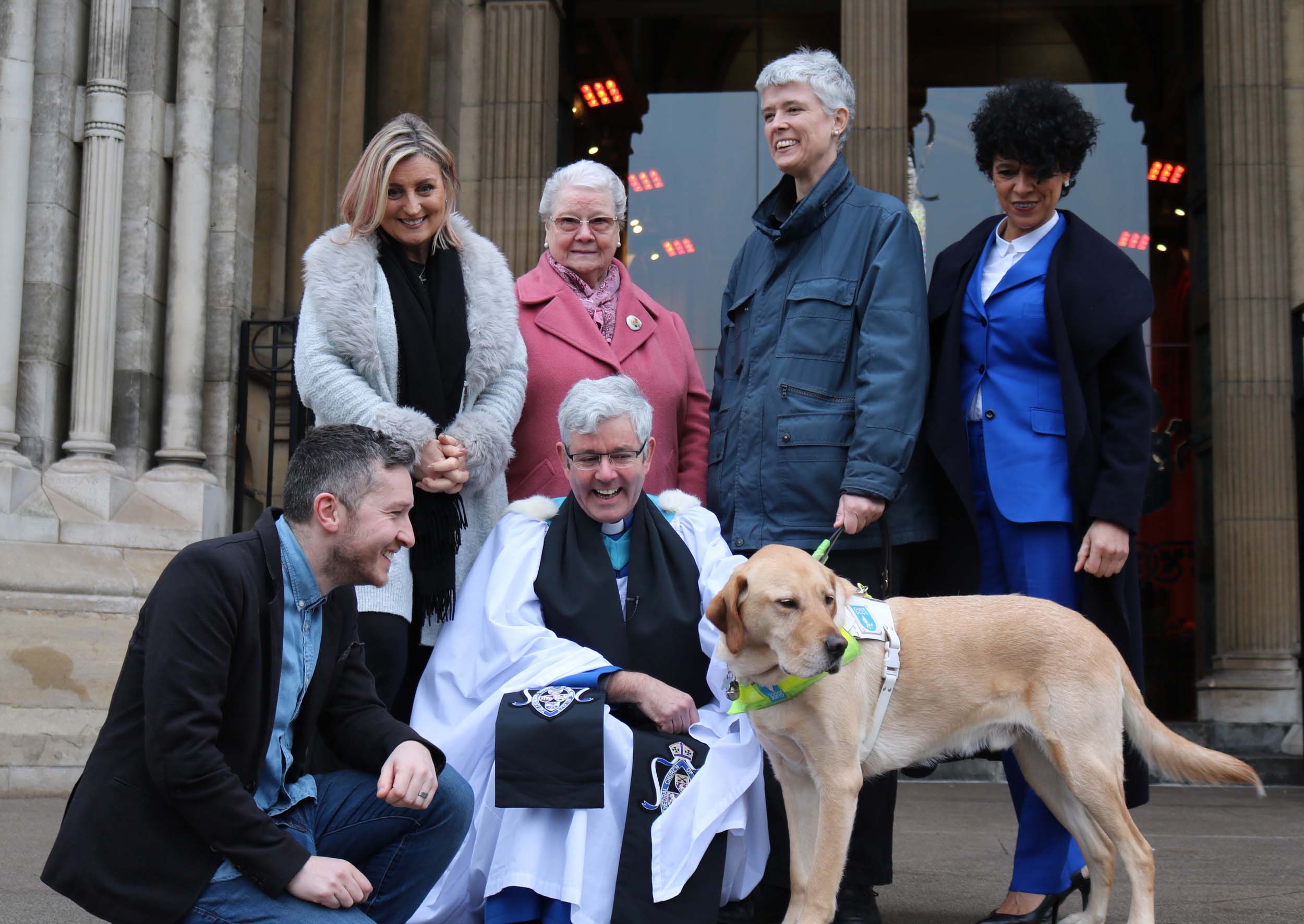 At the annual Good Samaritans Service at Belfast Cathedral on February 3, are, back from left: Lynda Bryans, special guest; Kathleen McGarrity, Colmcille Senior Citizens Club, Omagh; Diane Marks, Guide Dogs NI with Morris; Carolyn Stewart, Youth Lyric. Front: Peter Kernoghan, No More Traffik and Dean Stephen Forde.  Two hundred and twenty charities received grants totalling £168,000 raised at the Christmas 2018 Black Santa Sit-out.