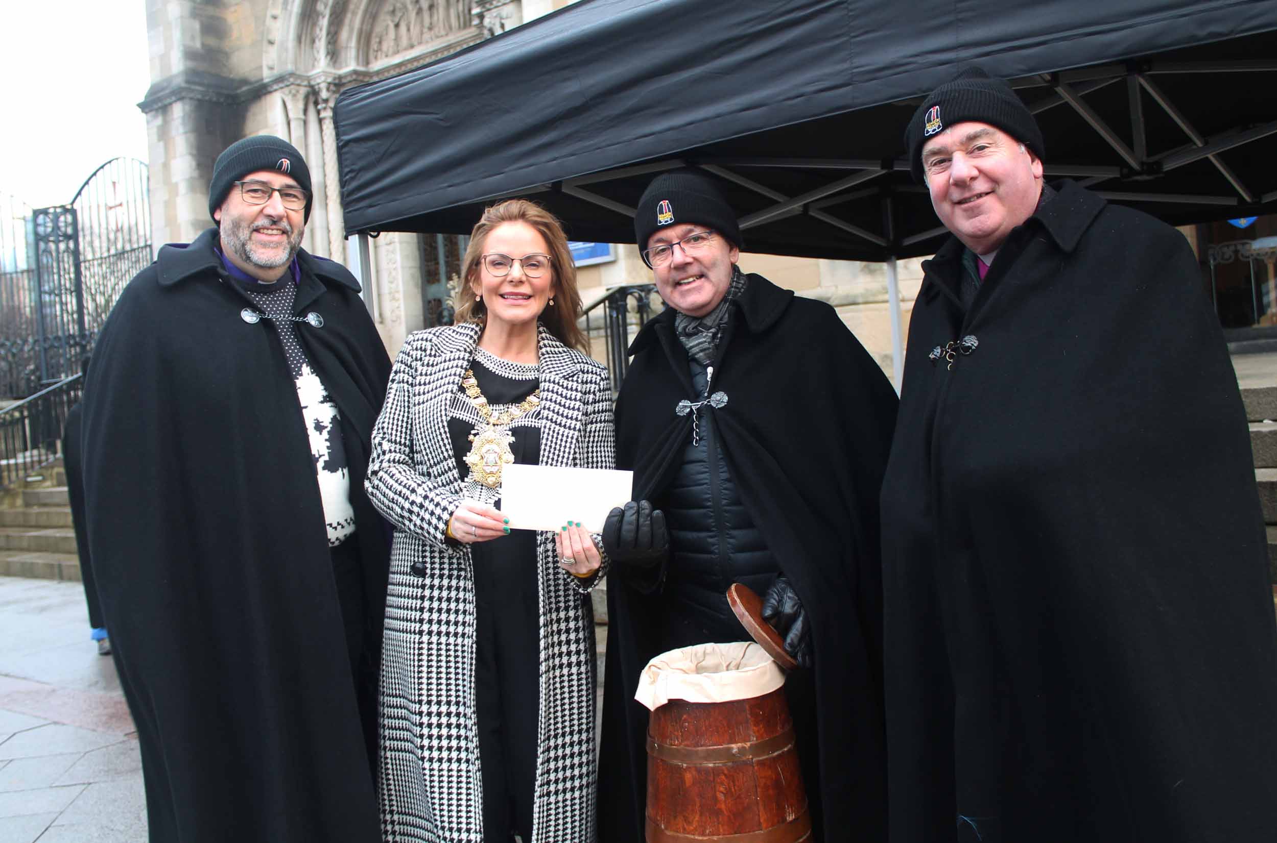 Belfast's Lord Mayor, Councillor Christina Black, second left,  is pictured with, from left, the Rt Rev George Davison, Bishop of Connor; Black Santa, the Very Rev Stephen Forde, Dean of Belfast; and the Rt Rev David McClay, Bishop of Down and Dromore.