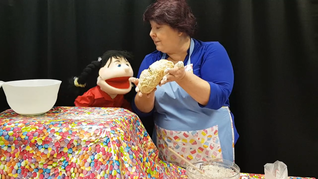 Baking Buddy Karen Webb demonstrates how to make soda bread, with a little help from Rosie the puppet.