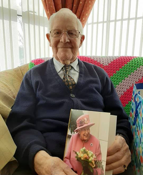 The Rev Canon Bob Wilkinson with his 100th birthday card from Her Majesty the Queen.