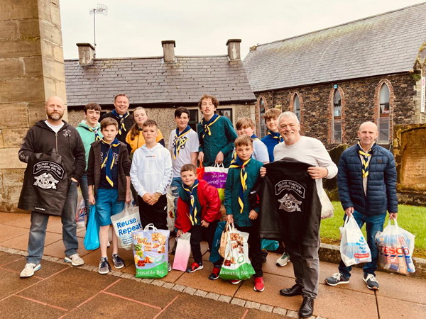 Kenny and Gerard and members of 5th Antrim Scouts load up their van with all the gifts donated by parishioners and families of the Scout troupe.