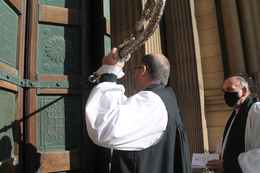 Bishop George Davison knocks on the West Door of Belfast Cathedral as part of the Service of Installation on March 13.