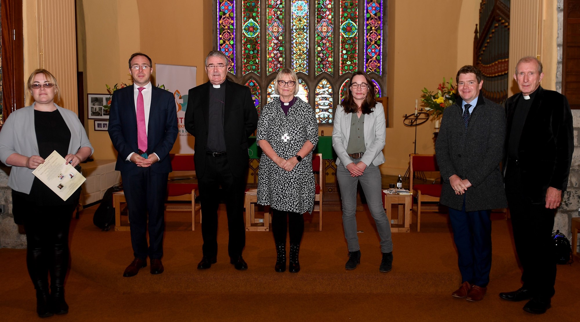 Sorca Clarke TD, Minister Robert Troy TD, Archbishop John McDowell, Bishop Pat Storey, Prof Katy Hayward, Minister Peter Burke TD, and Canon Alastair Graham.